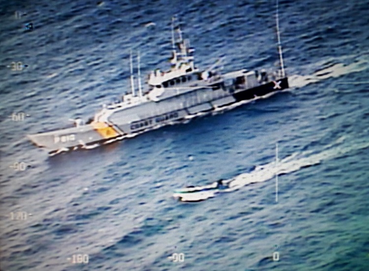 Coast Guard cutter Jaguar intercepts three-man boat at sea