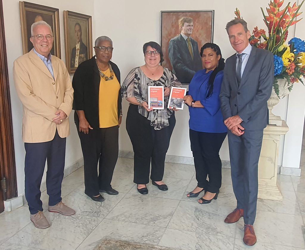 Acting Governor receives publications theme Antillean Heritage