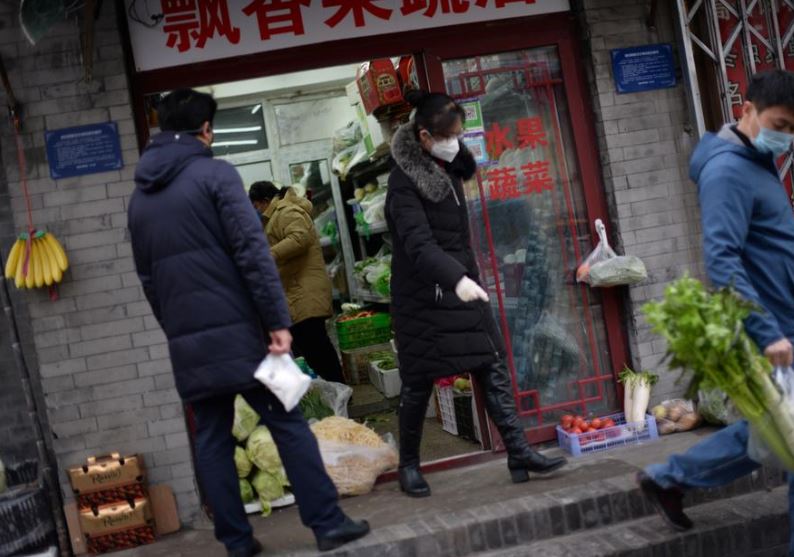 China sees fall in coronavirus deaths but WHO urges caution