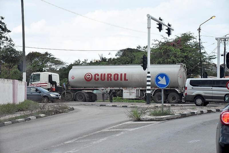 Man climbs on Curoil fuel truck